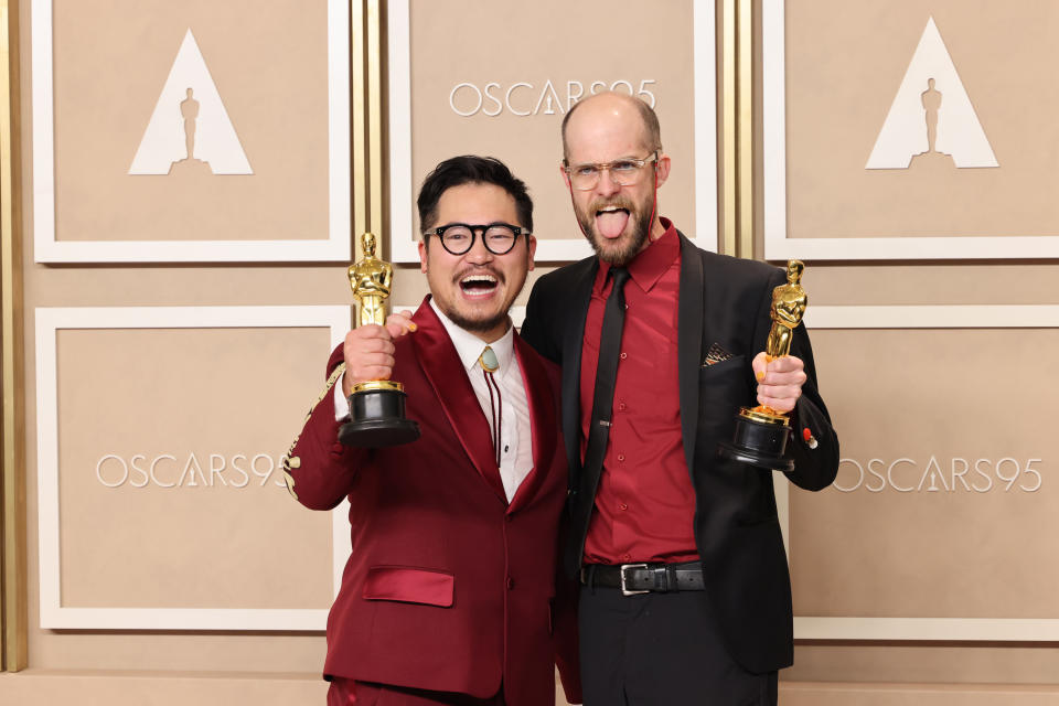 The Daniels excitedly holdup their Oscars backstage