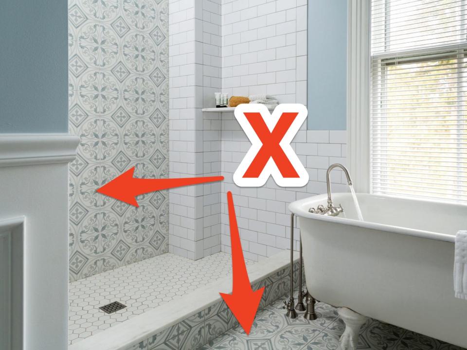 a red x and two arrows pointing at patterned tiles in a bathroom