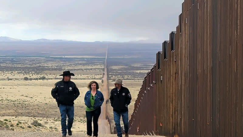 Celeste Maloy, R-Utah, middle, walks along the U.S.-Mexico border  with Kane County Sheriff Tracy Glover, left, and Utah County Sheriff Mike Smith, right, Sunday, March 24, 2024 in Cochise County, Arizona.