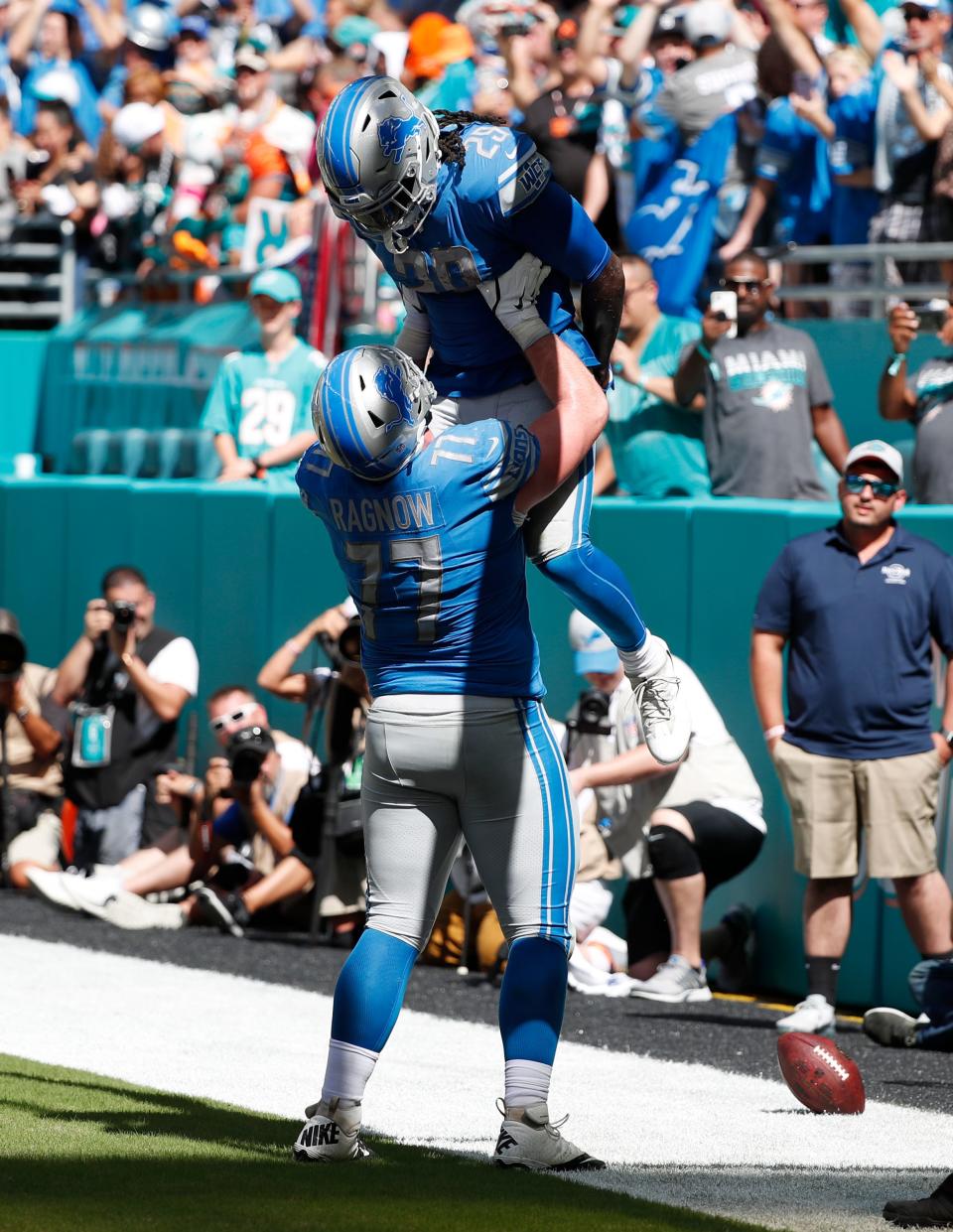 Lions offensive guard Frank Ragnow lifts running back LeGarrette Blount after Blount scored a touchdown, during the first half of the Lions' 32-21 win on Sunday, Oct. 21, 2018, in Miami Gardens, Fla.