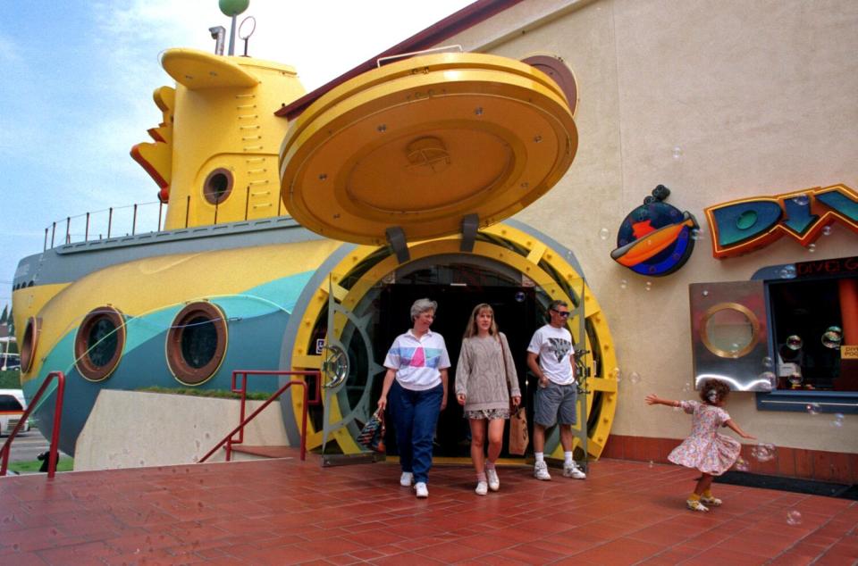 People walk out of a giant fake submarine