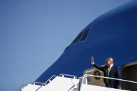 President Donald Trump waves as he arrives at Moffett Federal Airfield to attend a fundraiser, Tuesday, Sept. 17, 2019, in Mountain View, Calif. (AP Photo/Evan Vucci)