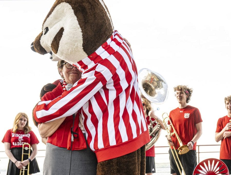 Blank hugs Bucky Badger at a campus send-off in spring 2022.