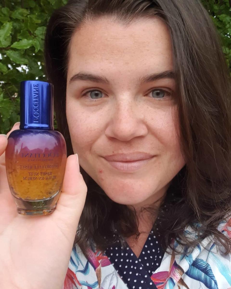 Australian woman holding up L’Occitane serum