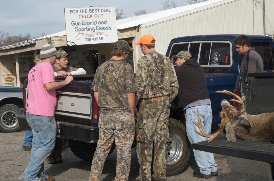 Hunters wait to have their deer tested for Chronic Wasting Disease.