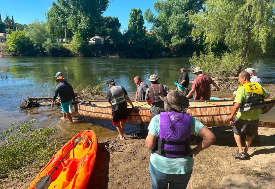 Paddlers put boats in the Tuolumne River for a one mile trip to the Neece Drive Boat Launch in the Tuolumne River Regional Park in Modesto, Calif., Friday, May 10, 2024.