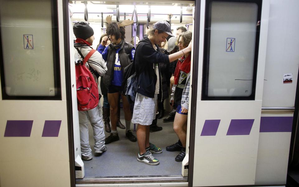 Passengers without their pants use a subway during the "No Pants Subway Ride" event in Sofia