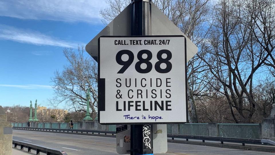 PHOTO: A 988 Suicide & Crisis Lifeline sign at the entrance to Taft Bridge in Washington is photographed on Feb. 10, 2023. (Kelly Livingston/ABC News)