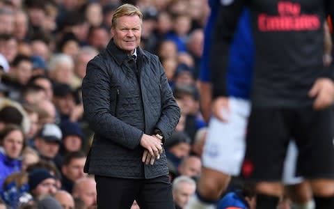 Everton's Dutch manager Ronald Koeman (L) watches from the touchline during the English Premier League football match - Credit: AFP/Getty Images