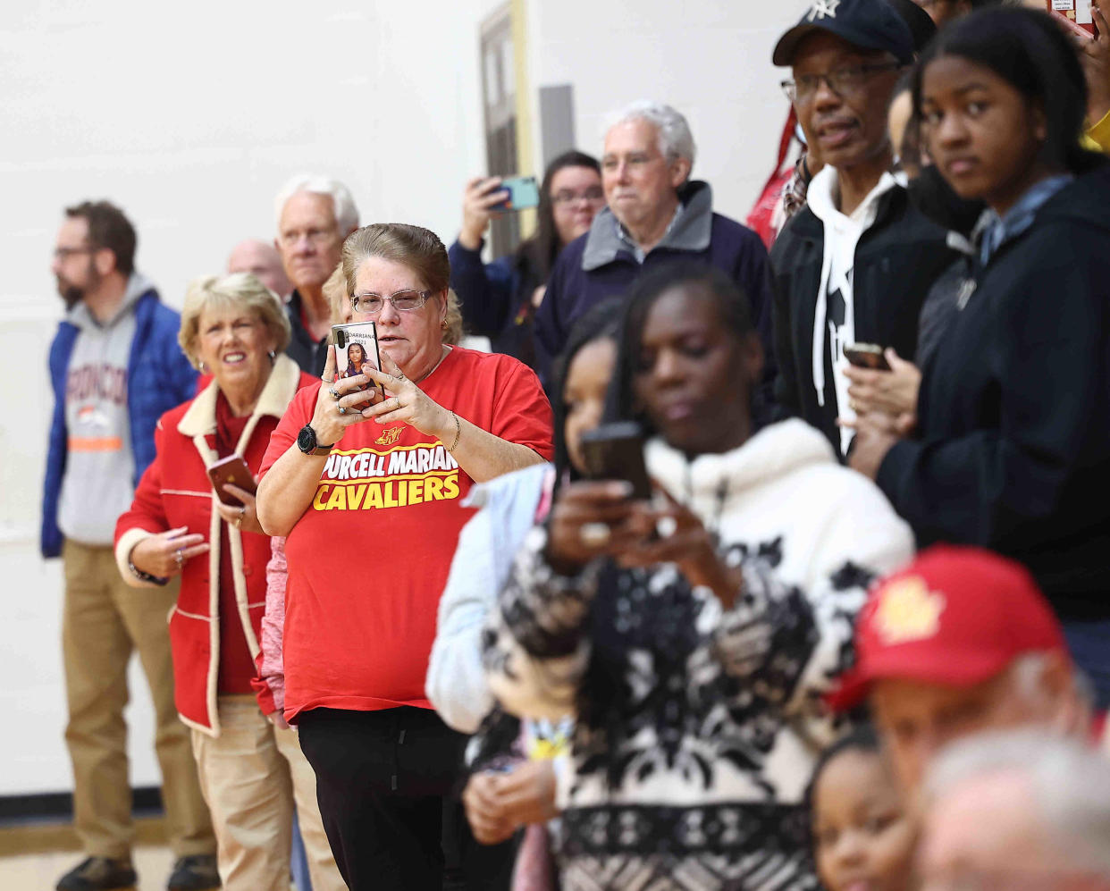 Maskless Purcell Marian fans cheer on the girls' basketball team on Sunday, March 13, 2022.