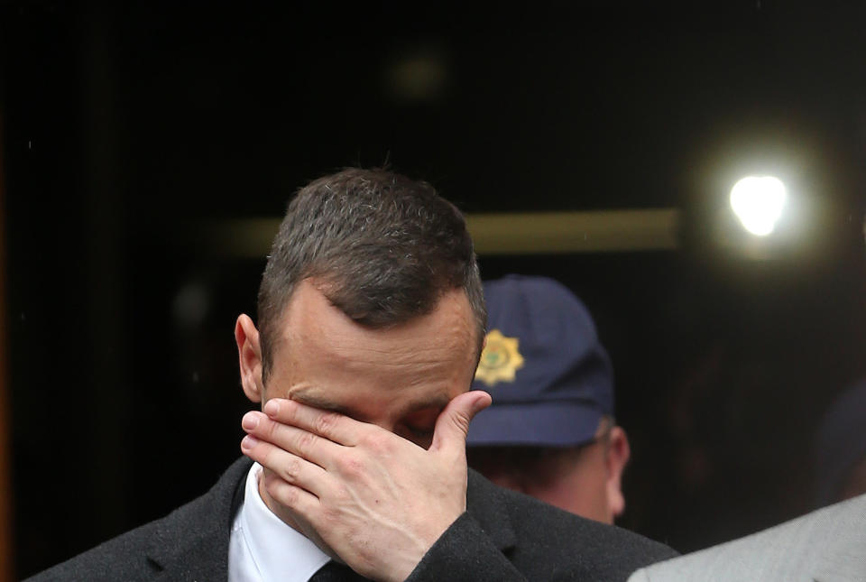 Oscar Pistorius, leaves the high court in Pretoria, South Africa, Monday, April 14, 2014. Pistorius is charged with murder for the shooting death of his girlfriend, Reeva Steenkamp, on Valentines Day in 2013. (AP Photo/Themba Hadebe)