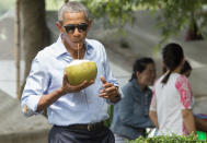 <p>President Barack Obama drinks from a coconut as he makes a surprise stop for a drink alonside the Mekong River in Luang Prabang on September 7, 2016. Obama became the first US president to visit Laos in office, touching down in Vientiane late on September 5 for a summit of East and South East Asian leaders. (Saul Loeb/AFP/Getty Images) </p>