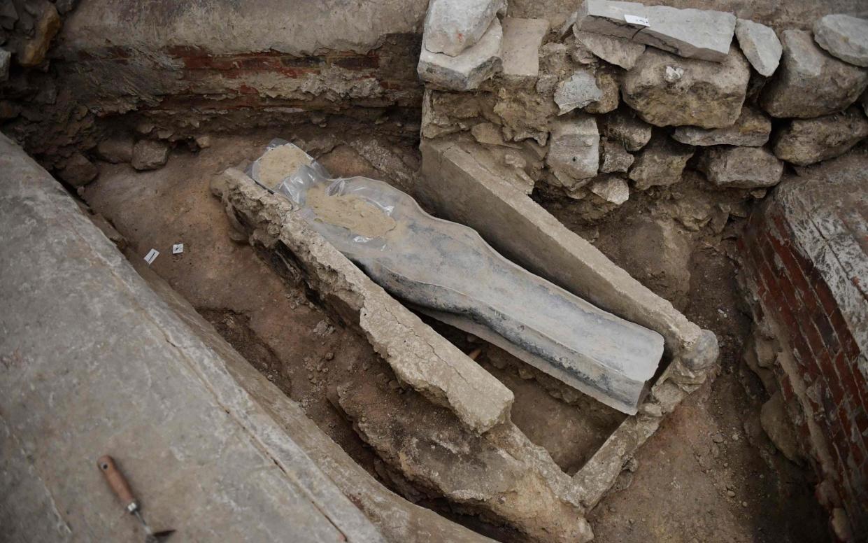 A 14th-century lead sarcophagus was discovered in the floor of the cathedral - JULIEN DE ROSA/AFP
