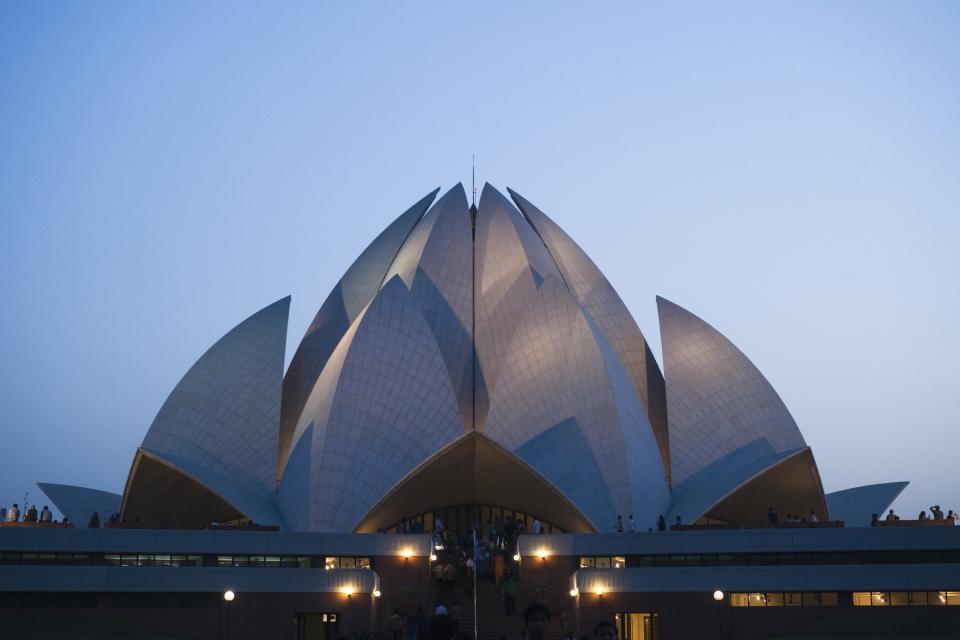 Temple lit up at dusk, Lotus Temple, New Delhi, India. (Photo by: Exotica.im/UIG via Getty Images)