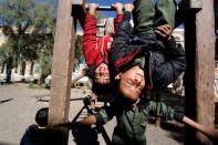 Boys play in a yard of an orphanage in Sanaa, Yemen, January 2, 2017. REUTERS/Khaled Abdullah