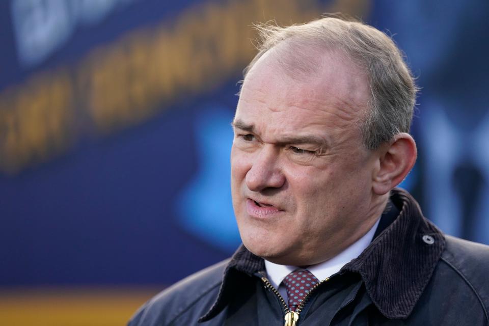 Liberal Democrat leader Sir Ed Davey speaks with members of the media during a rally in Guildford, as he unveils a new campaign poster vowing to 