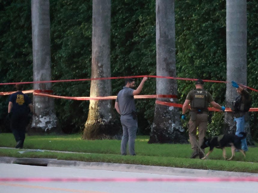 Law enforcement near trees.