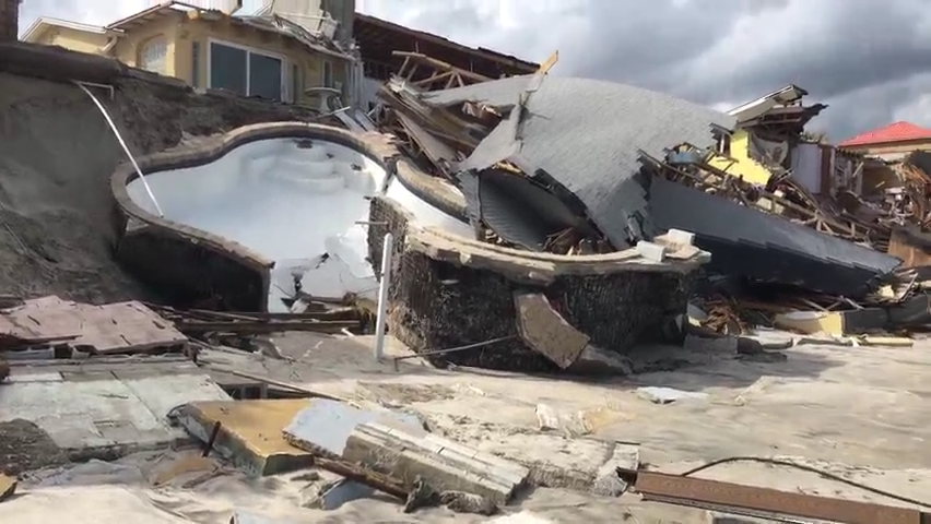 Multiple homes in Wilbur-by-the-Sea suffered devastating damage, with some collapsing into pieces after the surf-pounded dunes below them gave way.