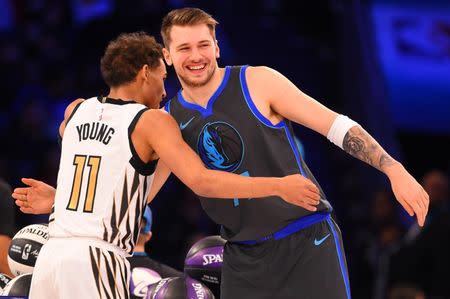 Feb 16, 2019; Charlotte, NC, USA; Atlanta Hawks guard Trae Young greets Dallas Mavericks guard Luka Doncic in the Skills Challenge during the NBA All-Star Saturday Night at Spectrum Center. Mandatory Credit: Bob Donnan-USA TODAY Sports