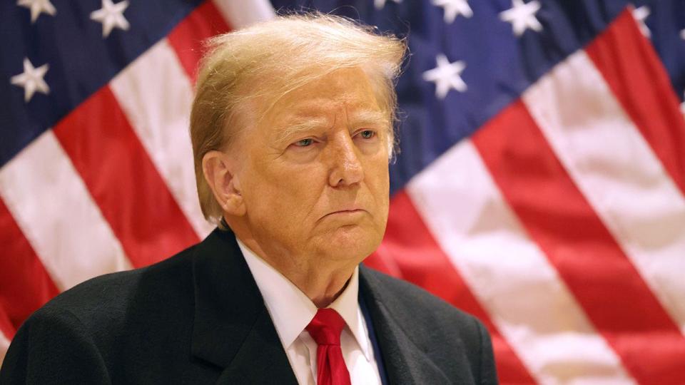 Former President Donald Trump listens as his attorney, Todd Blanche, speaks during a press conference at 40 Wall Street after a pre-trial hearing on March 25, 2024, in New York City. The trial is connected to allegations that the former President falsified business records to cover up a payment to adult film star Stormy Daniels during the 2016 election. It is the first trial of the election year, with Trump previously pleading not guilty to all counts.