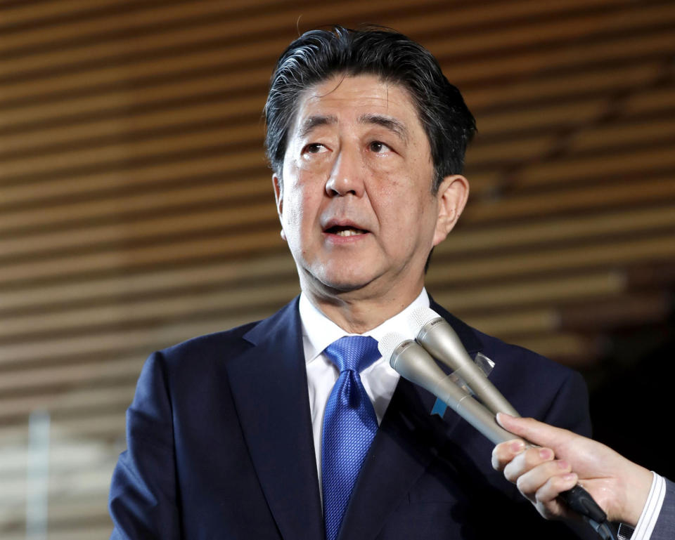 Japanese Prime Minister Shinzo Abe speaks to journalists following a strong earthquake, at his official residence in Tokyo Thursday, Sept. 6, 2018. A powerful earthquake has hit northern Japan near a major city. (Yohei Fukai/Kyodo News via AP)