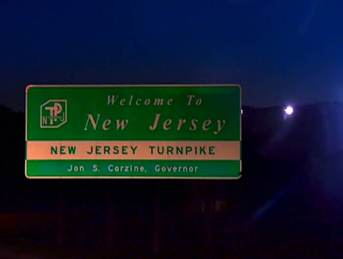 A photo of a street sign that says "New Jersey Turnpike"