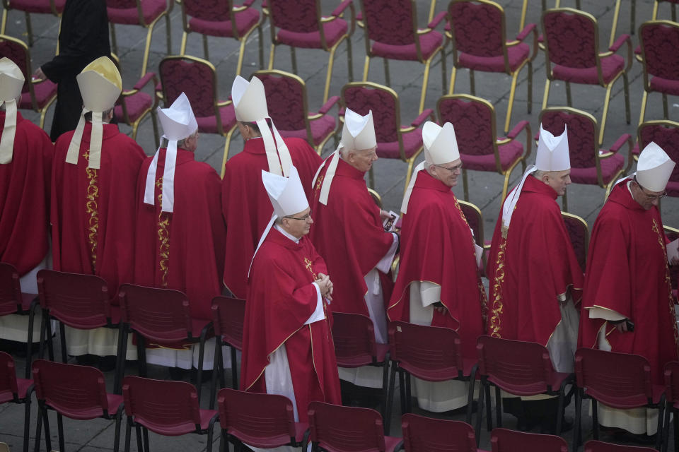 Members of the church arrive for the funeral mass for late Pope Emeritus Benedict XVI in St. Peter's Square at the Vatican, Thursday, Jan. 5, 2023. Benedict died at 95 on Dec. 31 in the monastery on the Vatican grounds where he had spent nearly all of his decade in retirement. (AP Photo/Ben Curtis)