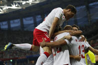 <p>Denmark players celebrate after teammate Mathias Jorgensen scored the opening goal </p>