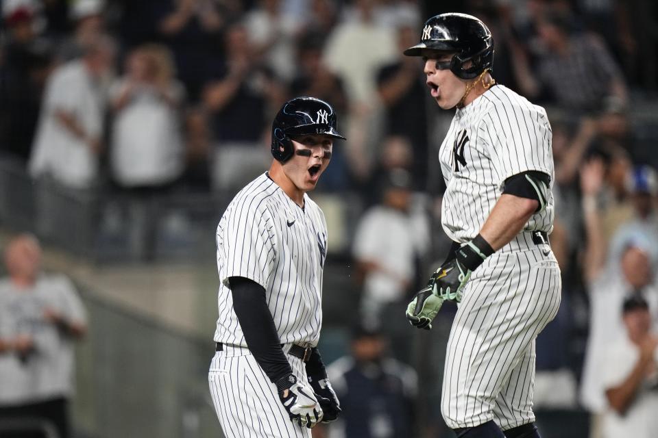 New York Yankees' Harrison Bader, right, celebrates with Anthony Rizzo, left, after they scored on a three-run home run during the eighth inning of a baseball game against the Baltimore Orioles, Monday, July 3, 2023, in New York. (AP Photo/Frank Franklin II)