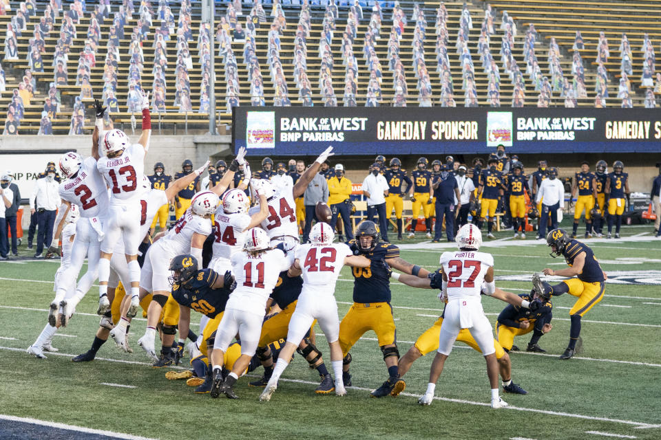 November 27, 2020; Berkeley, California, USA; California Golden Bears place kicker Dario Longhetto (30) has his point-after-touchdown blocked by the Stanford Cardinal during the fourth quarter at California Memorial Stadium. Mandatory Credit: Kyle Terada-USA TODAY Sports