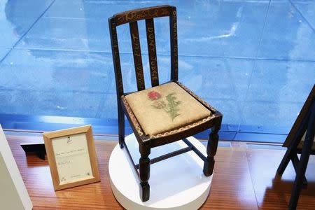 A chair used by British author J.K. Rowling while writing "Harry Potter and the Sorcerer's Stone" and "Harry Potter and the Chamber of Secrets" is shown in the window of Heritage Auctions in New York April 4, 2016. REUTERS/Lucas Jackson -