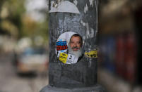 A campaign sticker depicting ultra-Orthodox Jewish candidate in Jerusalem's mayoral election Yossi Daitsh is seen on a street pole in Jerusalem October 18, 2018. REUTERS/Ammar Awad