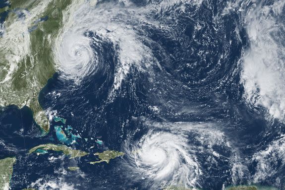 An image acquired by the GOES-13 satellite at 1:15 pm local time  of Hurricanes Maria in the Caribbean (bottom) and Jose (L, top) in the North Atlantic Ocean.