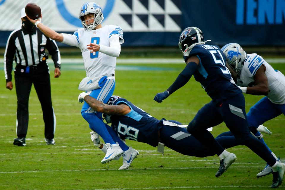 Detroit Lions quarterback Matthew Stafford is pressured by the Tennessee Titans during the second quarter Dec. 20, 2020, in Nashville, Tennessee.