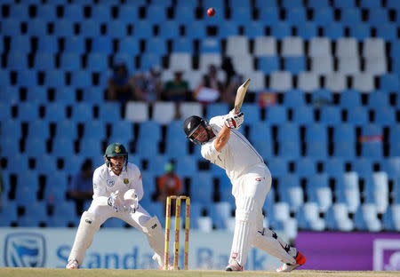 Cricket - New Zealand v South Africa - second cricket test match - Centurion Park, Centurion, South Africa - 30/8/2016. New Zealand's Doug Bracewell plays a shot as South Africa's wicketkeeper Quinton de Kock looks on. REUTERS/Siphiwe Sibeko