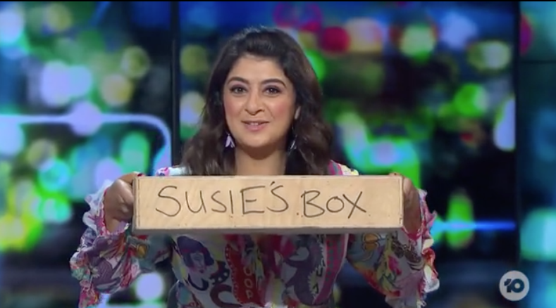 Susie Youssef displays the 'empty box' she keeps under her desk as a footrest