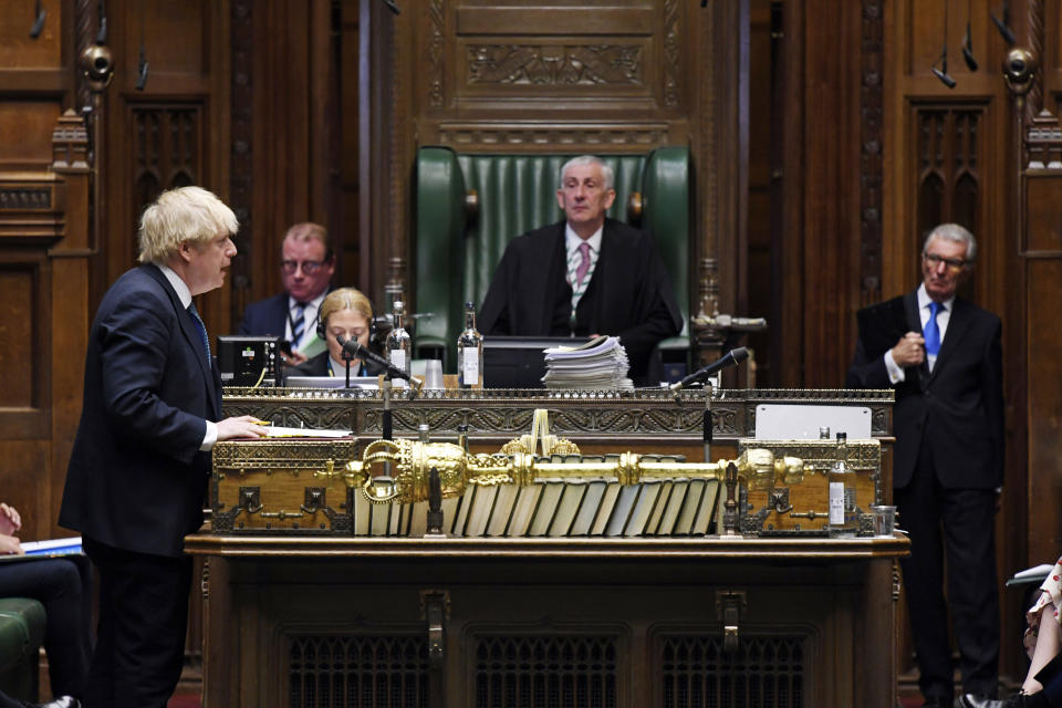 In this handout photo provided by UK Parliament, Britain's Prime Minister Boris Johnson speaks during Prime Minister's Questions in the House of Commons, London, Wednesday, May 13, 2020. (Jessica Taylor/UK Parliament via AP)