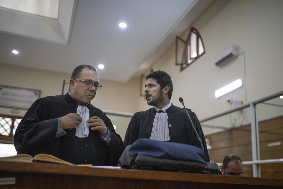 Lawyers gather inside a court room before the start of a final trial session for suspects charged in connection with killing of two Scandinavian tourists in Morocco's Atlas Mountains, in Sale, near Rabat, Morocco, Thursday, July 18, 2019. The three main defendants in the brutal slaying of two female Scandinavian hikers have asked for forgiveness from Allah ahead of a verdict. (AP Photo/Mosa'ab Elshamy)