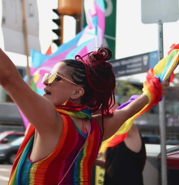 Claire Pearen protests on Whyte Avenue at 'Pride Corner.' (Submitted by Claire Pearen - image credit)