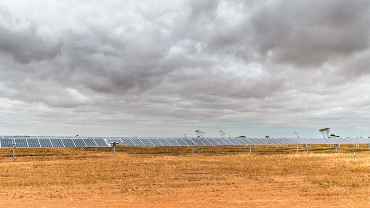 clouds above solar panels