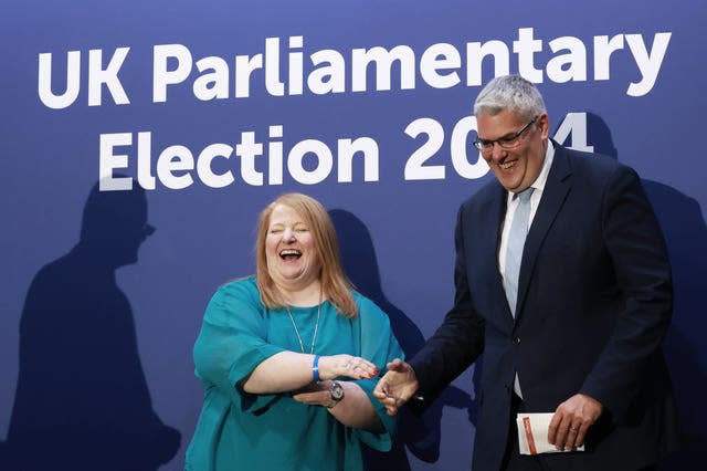 DUP leader Gavin Robinson shakes hands with Alliance Party leader Naomi Long after retaining his seat in the East Belfast constituency