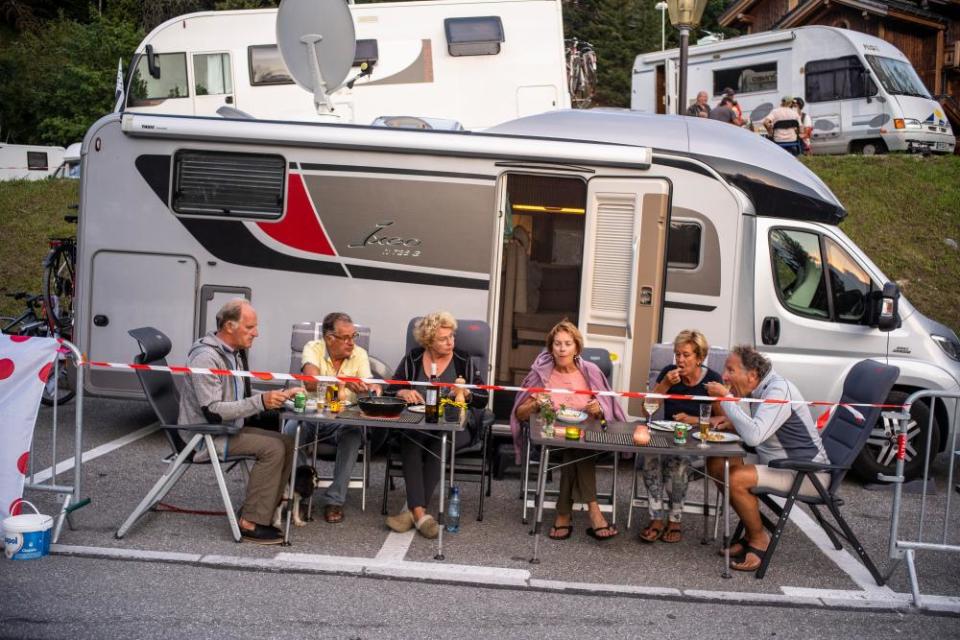 A Dutch family of two brothers and one sister and their husbands and wives eat dinner after coming together to support the Jumbo team and their leader Primos Roglic ahead of the 17th stage in Meribel, France. This is the fourth time the siblings have attended to the tournament together and their third stage for this year.