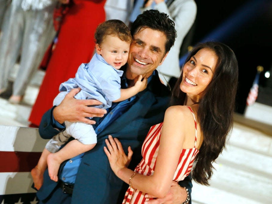 John Stamos and wife Caitlin McHugh with their son Billy.