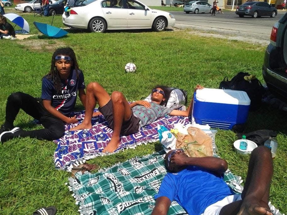 Maria Francis and her family, currently from Upper Mount Bethel, watched the Aug. 21, 2017, total solar eclipse from Kentucky with safe solar eyeglasses. Pictured from left are sons Jordan and Jhonson, and their father John Francis. Not shown: Maria and her daughter Serabi.