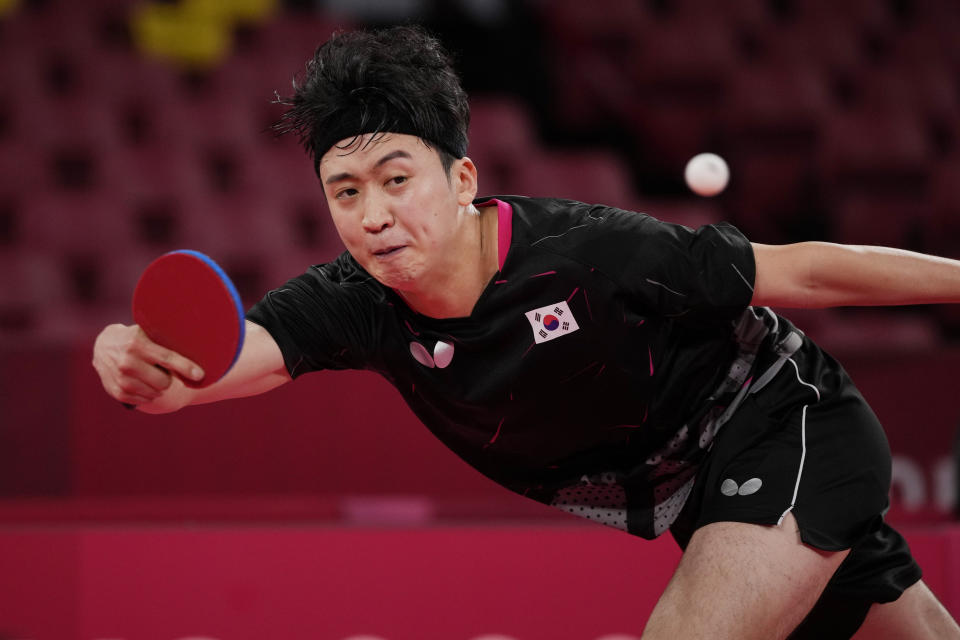 South Korea's Jeoung Youngsik competes during the table tennis men's singles third round match against Greece's Panagiotis Gionis at the 2020 Summer Olympics, Tuesday, July 27, 2021, in Tokyo. (AP Photo/Kin Cheung)