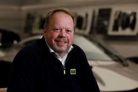 Andy Palmer, CEO of Aston Martin poses for a photograph at their world headquarters in Gaydon