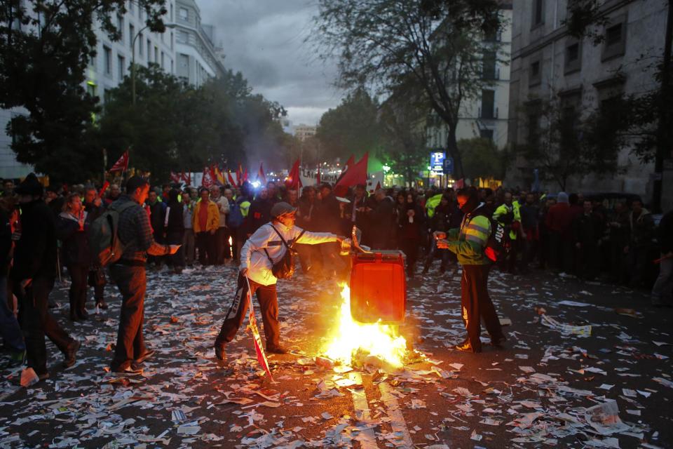 Cleaning workers burn garbage during a protest in Madrid