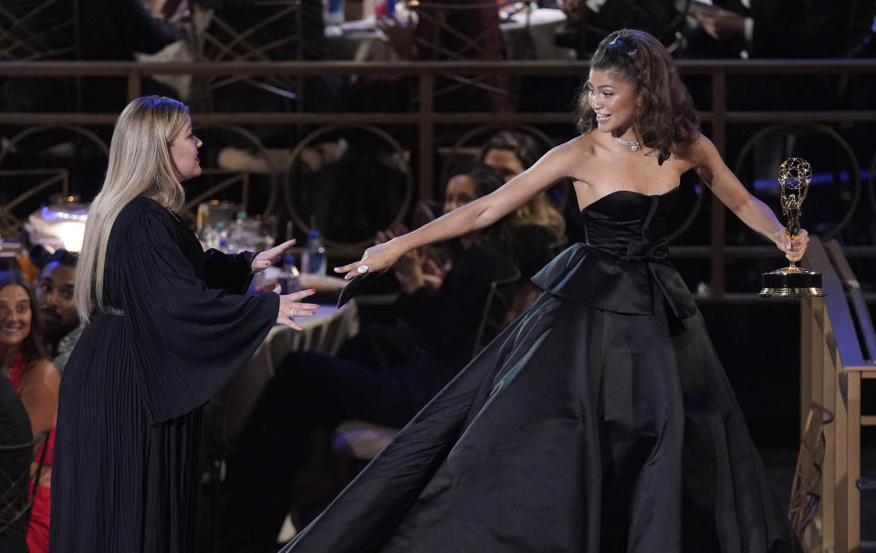 Kelly Clarkson, left, congratulates Zendaya, the winner of the Emmy for outstanding lead actress in a drama series for "Euphoria" at the 74th Primetime Emmy Awards on Monday, Sept. 12, 2022, at the Microsoft Theater in Los Angeles. (AP Photo/Mark Terrill)