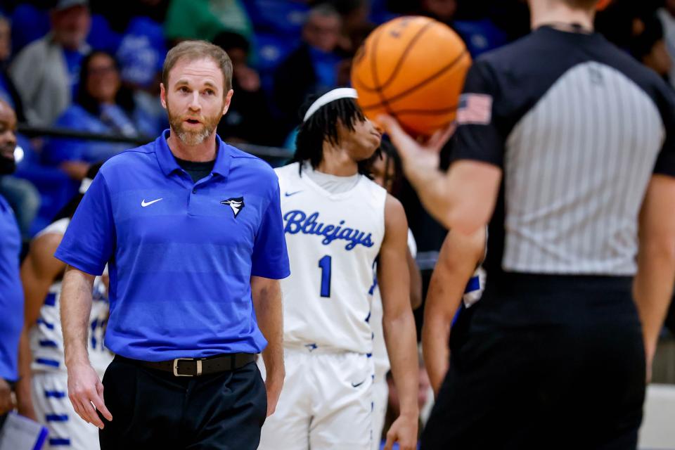 Guthrie’s head coach Nathan Pennypacker talks to the referee during a high school basketball game between Guthrie and Crossings Christian in Guthrie, Okla., on Tuesday, Feb. 13, 2024.