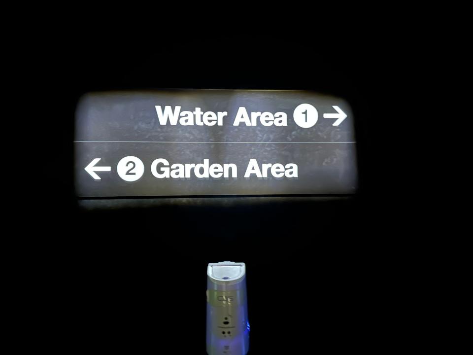 garden area or water area sign with arrows